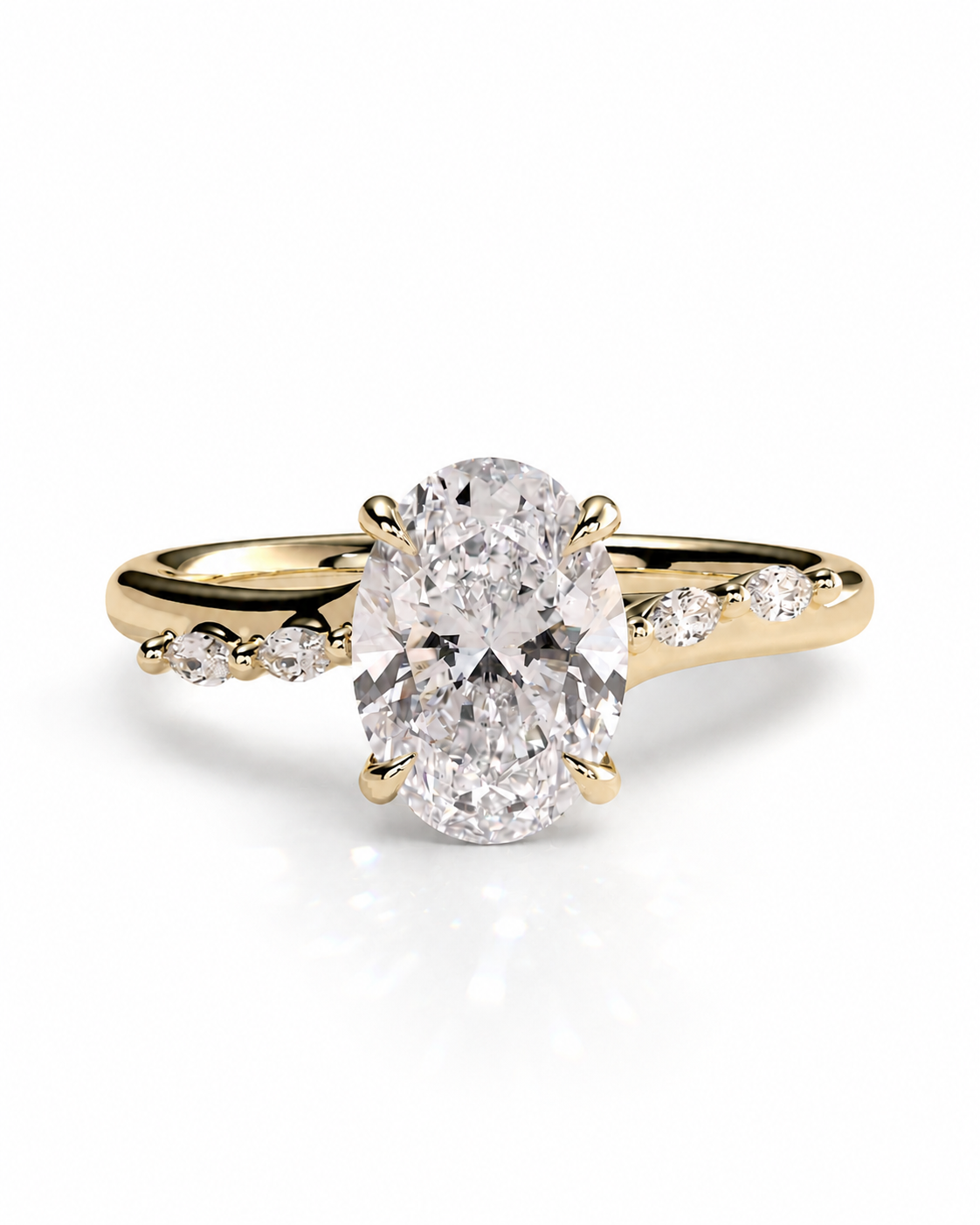 color_10K_YG, color_14K_YG &&An oval diamond engagement ring with a yellow gold band featuring small round diamonds along the shoulders, set against a clean white background.