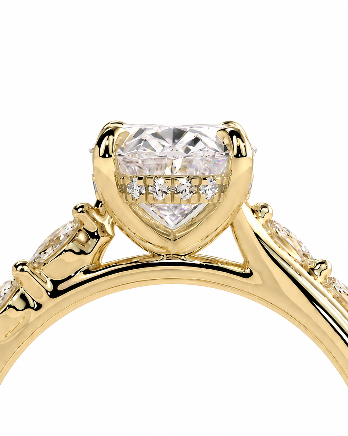 color_10K_YG, color_14K_YG &&A close-up of a yellow gold ring featuring a heart-shaped clear gemstone in a prong setting, with smaller accent stones along the band, shown against a plain white background.