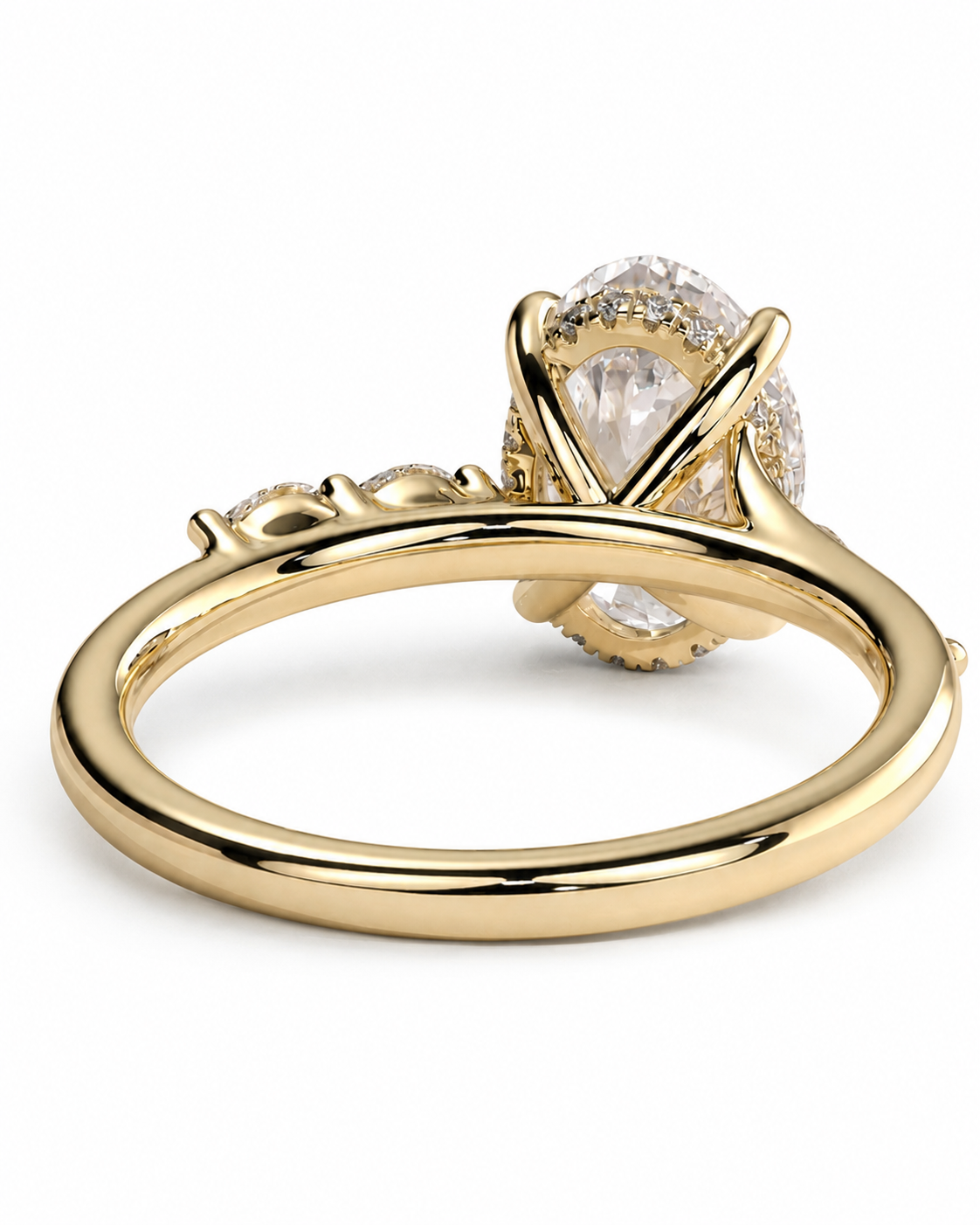color_10K_YG, color_14K_YG &&A yellow gold ring featuring a large oval clear gemstone in a prong setting with a halo of smaller clear stones, shown on a clean white background.