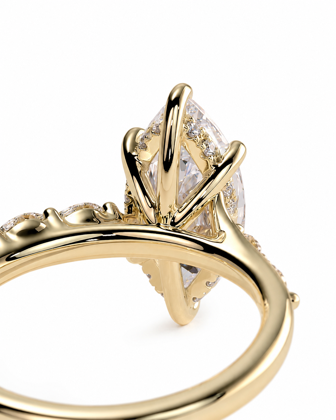 color_10K_YG, color_14K_YG &&Close-up of a gold ring with a marquise-cut clear gemstone in a prong setting, accented with small pavé stones on a white background.