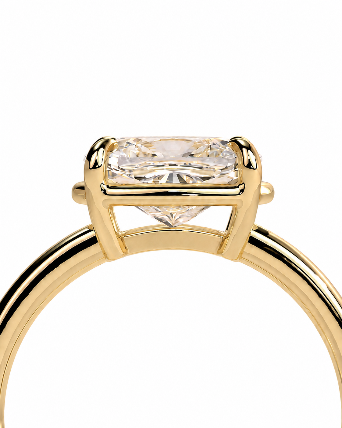 color_10K_YG, color_14K_YG &&A close-up of a yellow gold ring featuring a rectangular clear gemstone in a four-prong setting, shown against a plain white background.