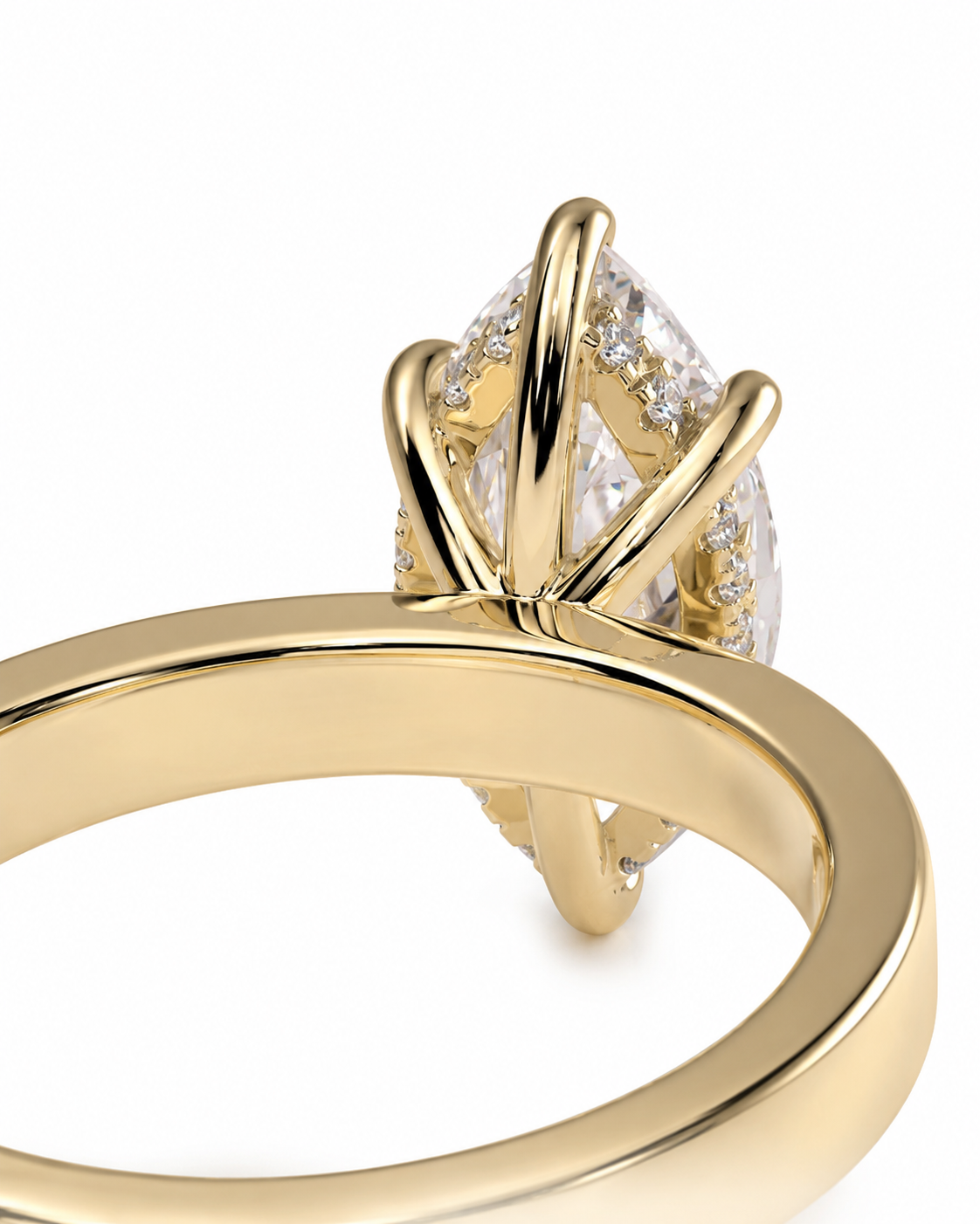 color_10K_YG, color_14K_YG &&A close-up of a gold ring featuring a large clear marquise-cut center stone and smaller clear stones along the shoulders, set in a polished yellow gold band against a white background.