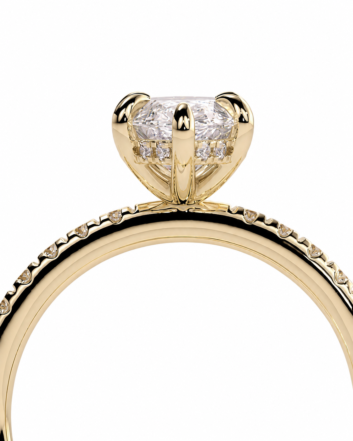 color_10K_YG, color_14K_YG &&A close-up shot of a yellow gold engagement ring featuring a large round brilliant-cut center stone in a four-prong setting, with a diamond-encrusted band, on a solid white background.