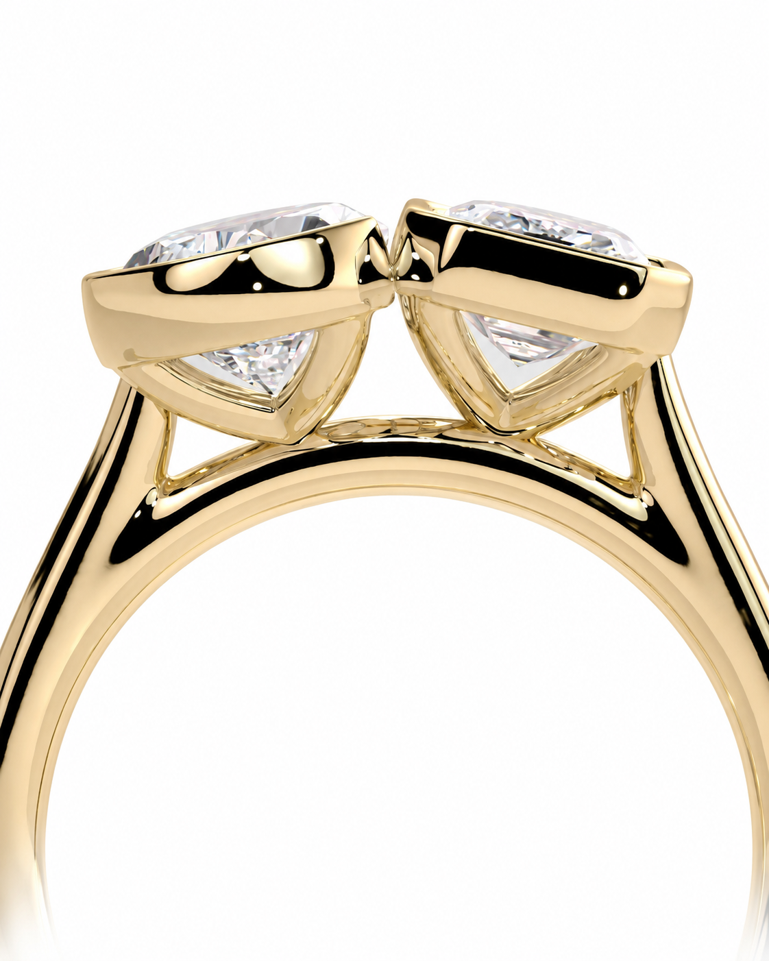 color_10K_YG, color_14K_YG &&A close-up of a yellow gold ring featuring two triangular-cut clear gemstones in a prong setting, shown against a solid white background.