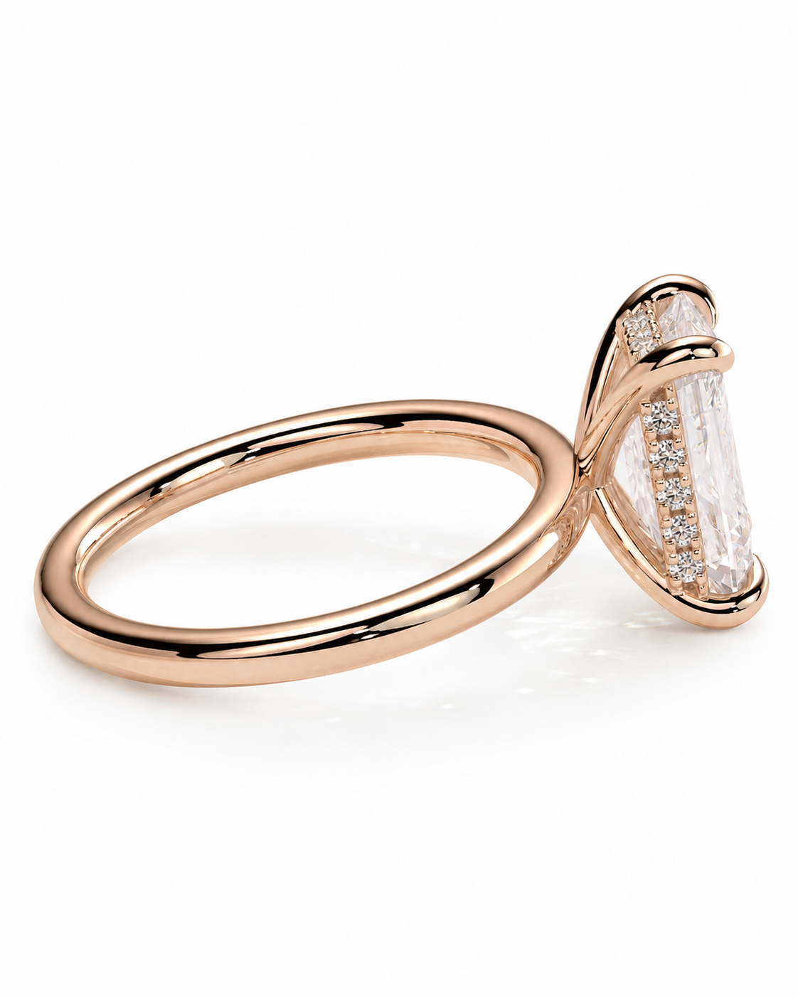 color_10K_RG, color_14K_RG &&
A rose gold ring with a large marquise-cut clear center stone and smaller accent stones along the side, shown on a clean white background.