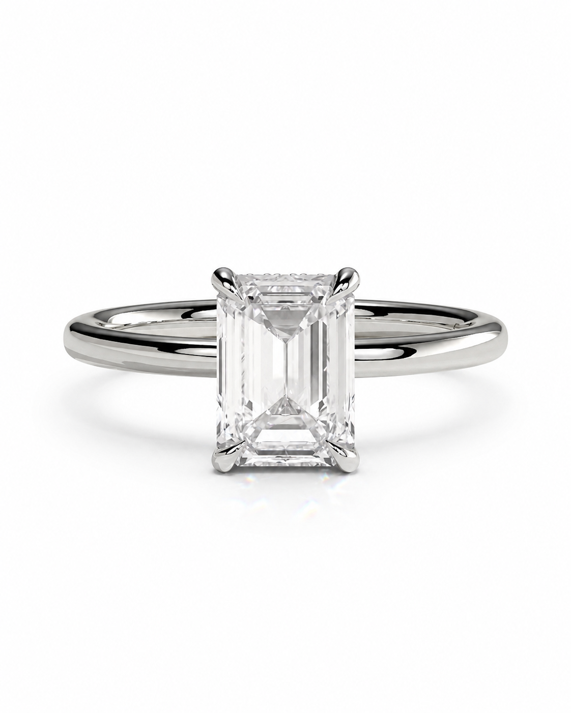 color_925_SIL,color_935_ARG,color_10K_WG, color_14K_WG &&
An emerald-cut diamond engagement ring with a polished silver-colored band, shown on a clean white background.