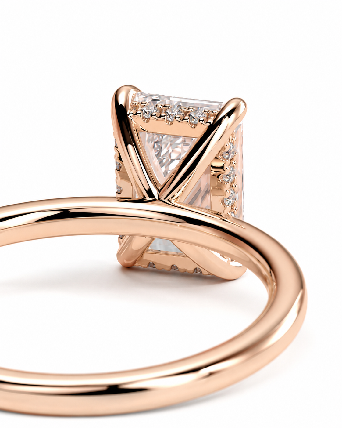 color_10K_RG, color_14K_RG &&
Rose gold ring with a large rectangular clear gemstone in a four-prong setting, accented with small pave stones along the sides, shown on a white background.