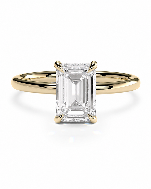 color_10K_YG, color_14K_YG &&
An emerald-cut diamond engagement ring with a yellow gold band, shown on a clean white background.