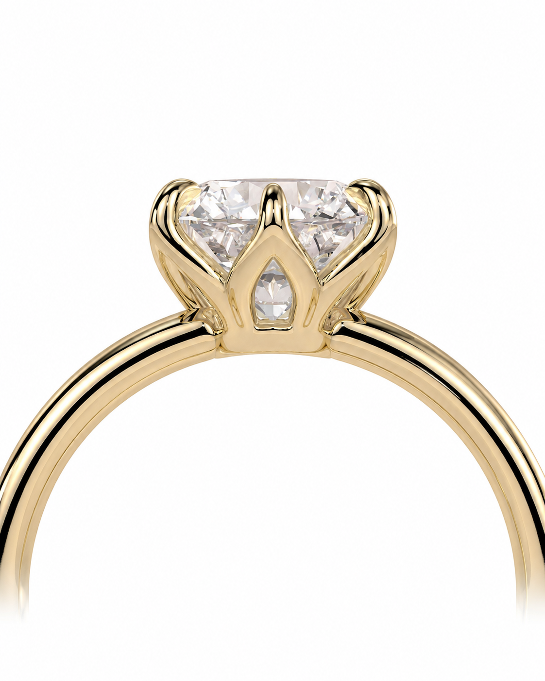 color_10K_YG, color_14K_YG &&A close-up of a yellow gold ring with a crown-like setting holding a clear heart-shaped diamond and smaller side diamonds, shown on a white background.