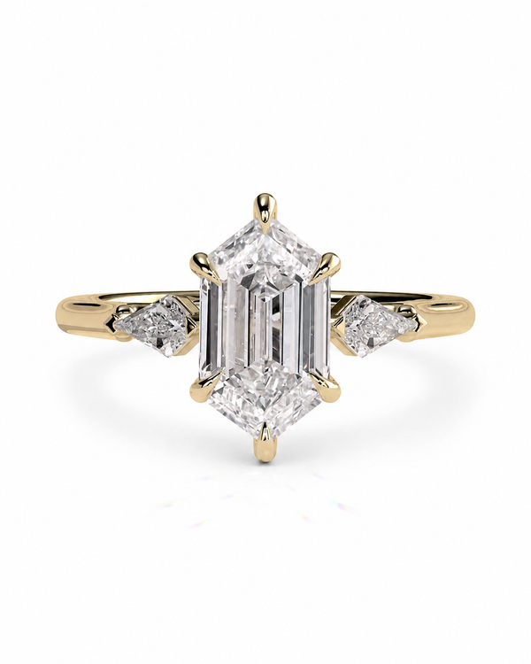 color_10K_YG, color_14K_YG &&A yellow gold ring featuring a large emerald-cut diamond center stone with smaller round and marquise-cut diamonds on the shoulders, set against a plain white background.