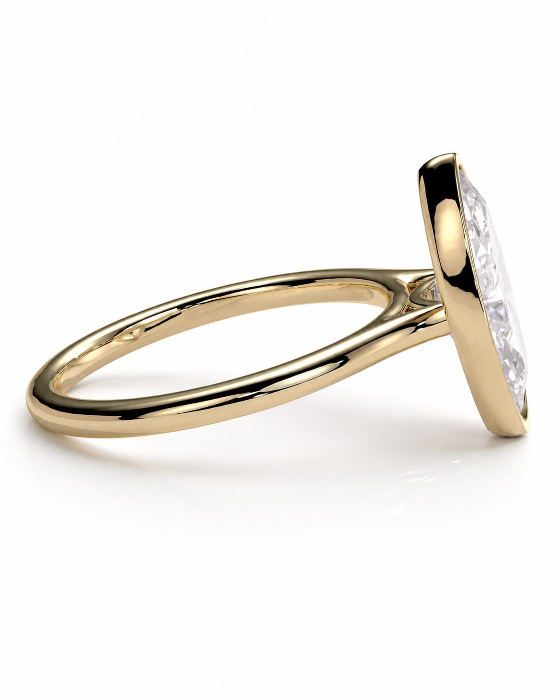 color_10K_YG, color_14K_YG &&A yellow gold ring with a bezel-set clear marquise-cut gemstone, shown from a side angle on a clean white background.
