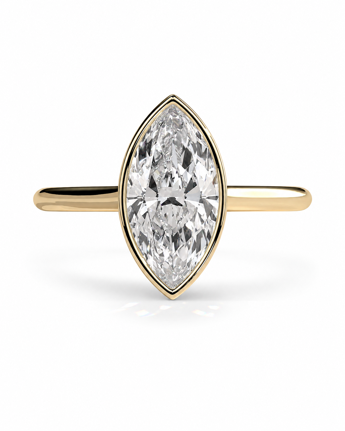color_10K_YG, color_14K_YG &&A yellow gold ring featuring a marquise-cut clear gemstone in a bezel setting, shown against a plain white background.