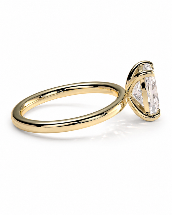 color_10K_YG, color_14K_YG &&A yellow gold ring with a marquise-cut clear gemstone in a prong setting, shown on a clean white background.