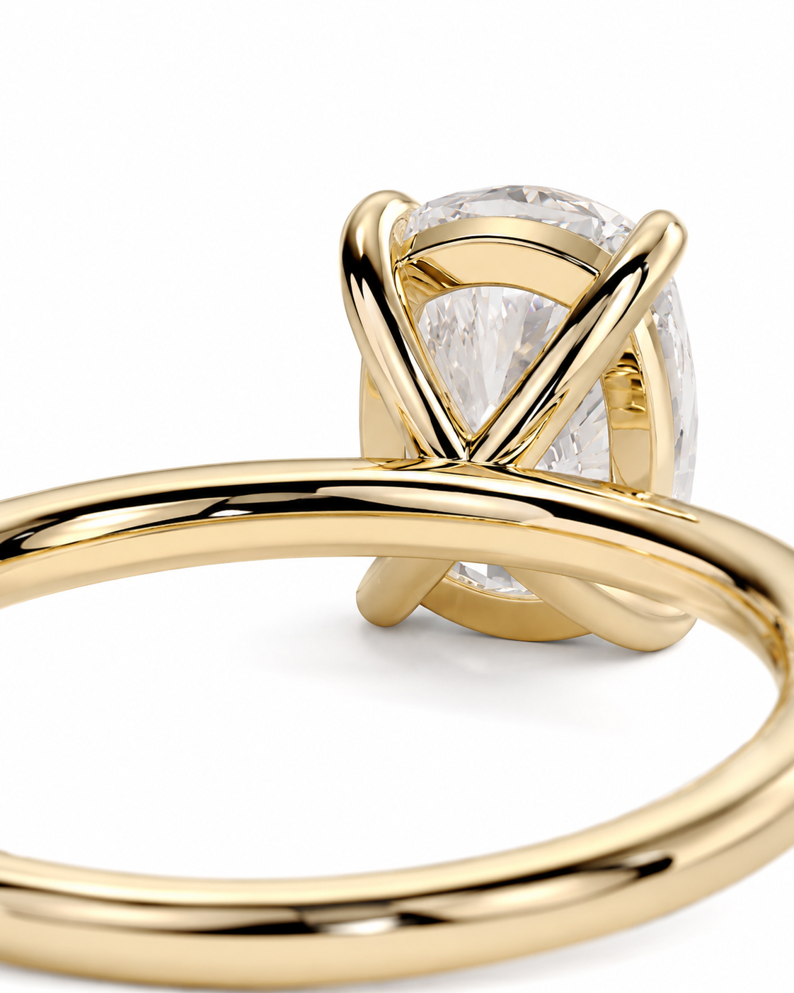 color_10K_YG, color_14K_YG &&A close-up shot of a yellow gold ring featuring a large oval clear gemstone in a twisted, wrap-around setting, shown against a plain white background.