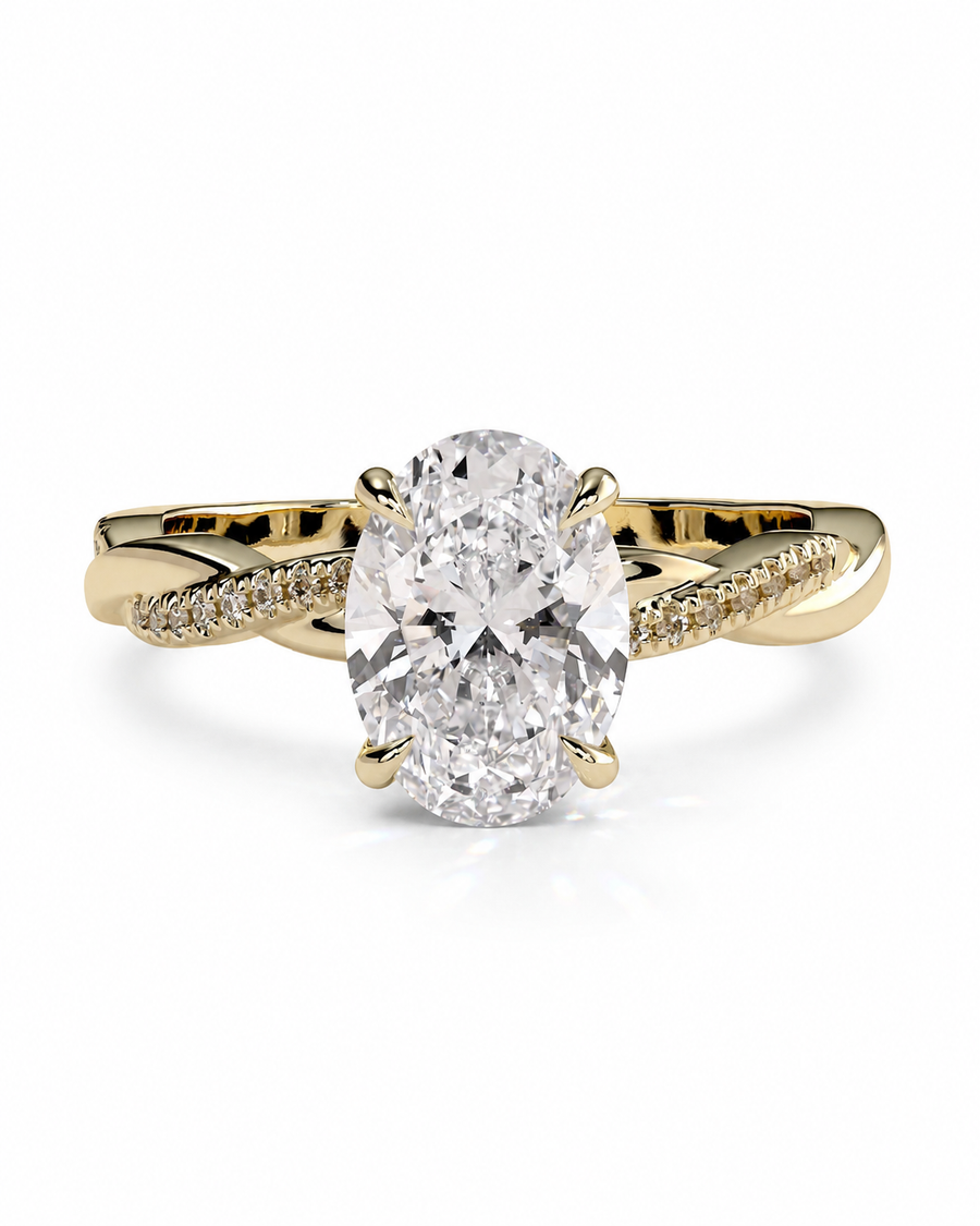 color_10K_YG, color_14K_YG &&An oval-cut diamond engagement ring with a yellow gold band featuring pavé-set diamonds, shown on a clean white background.
