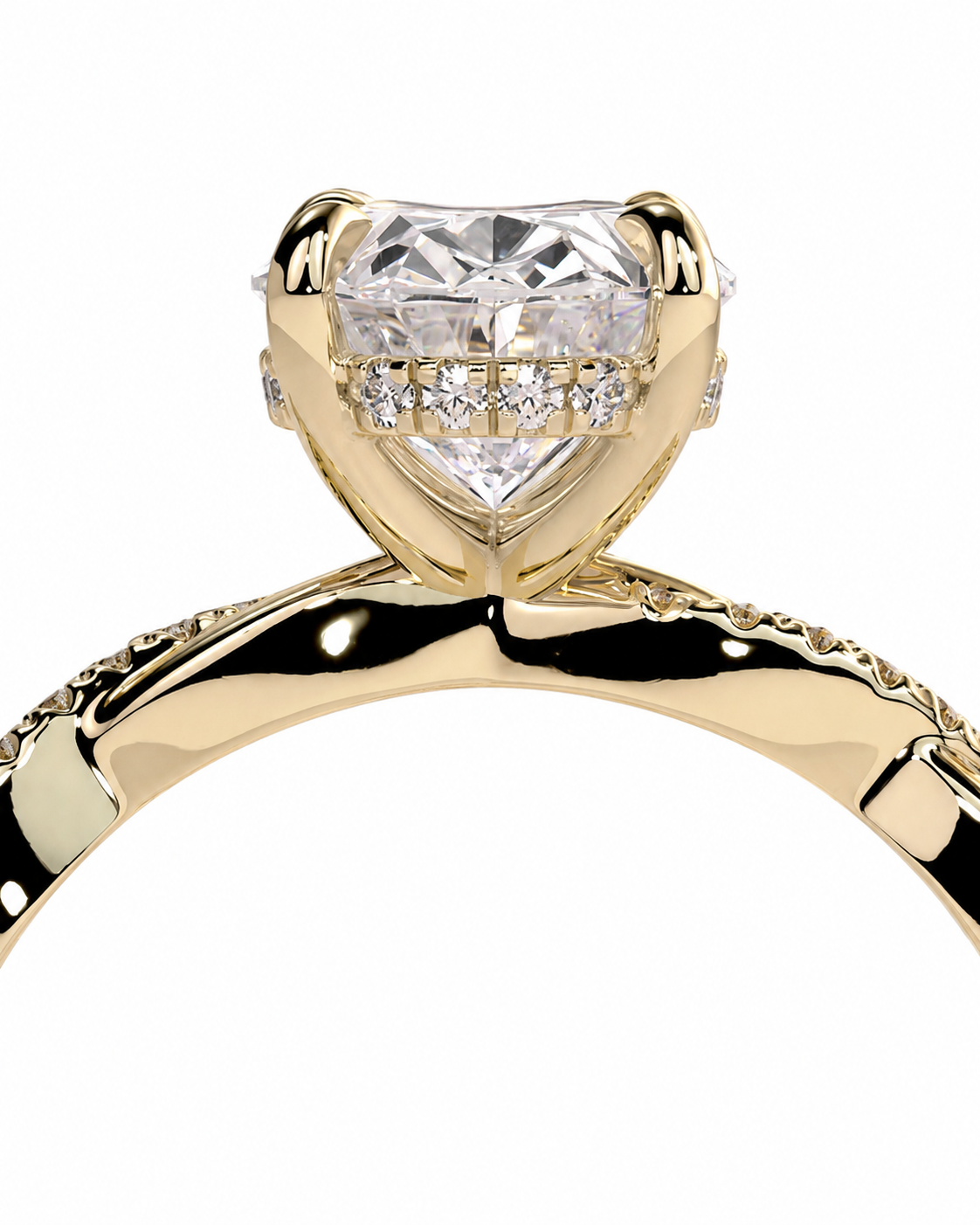 color_10K_YG, color_14K_YG &&A close-up studio shot of a yellow gold ring with a heart-shaped diamond center stone and smaller diamonds along the band, set against a plain white background.