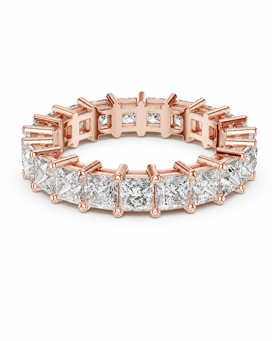 color_10K_RG, color_14K_RG &&	A rose gold eternity band ring featuring a continuous line of princess-cut clear diamonds in a prong setting, shown on a clean white background.