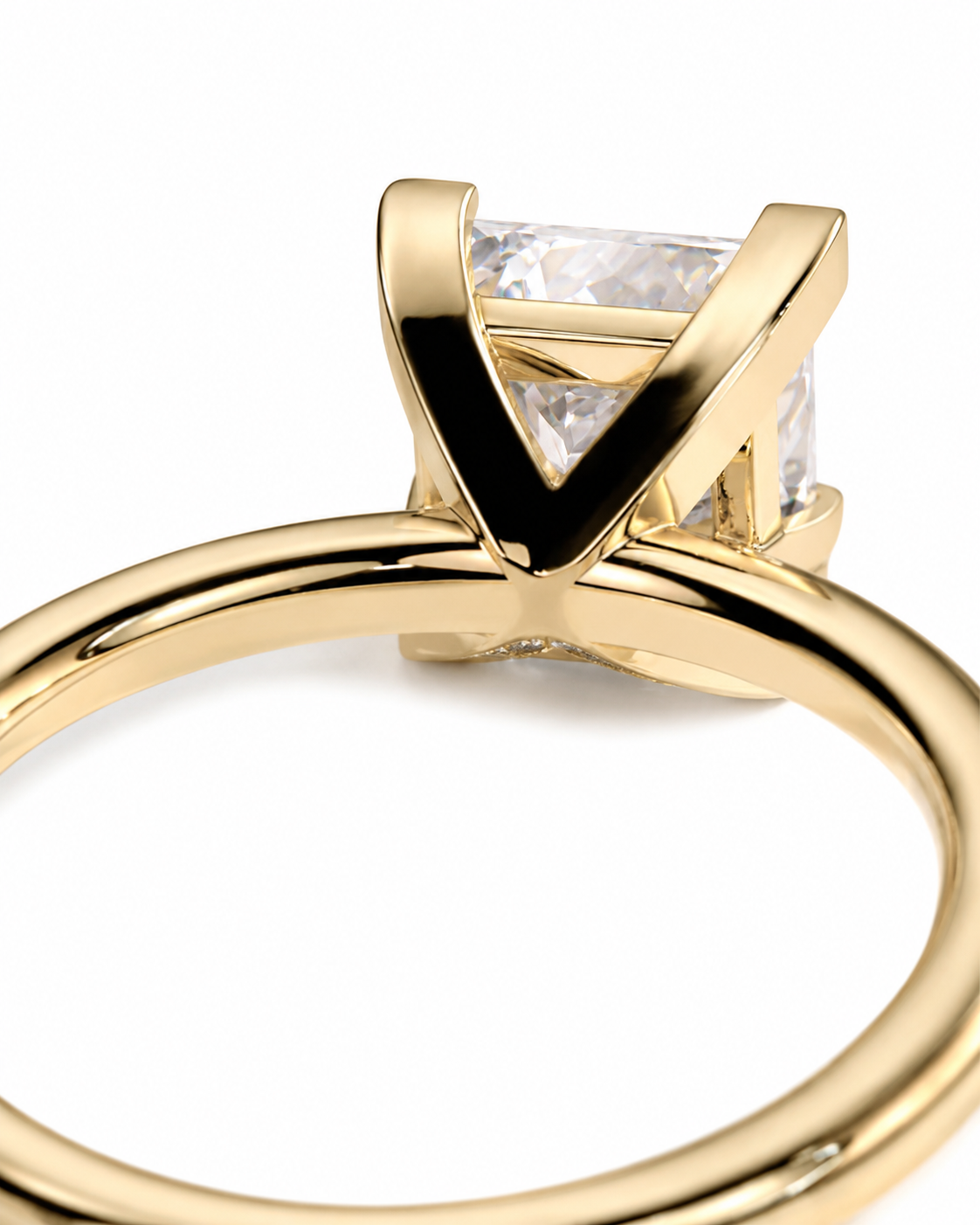 color_10K_YG, color_14K_YG &&A close-up of a yellow gold ring featuring a square clear gemstone in a V-prong setting, shown against a solid white background.