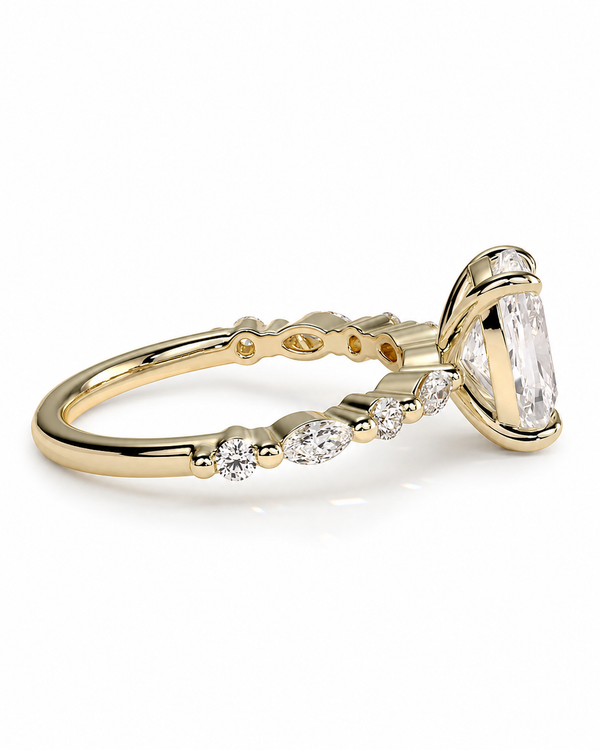 color_10K_YG, color_14K_YG &&A yellow gold ring featuring a large marquise-cut clear gemstone in a prong setting, with smaller round and marquise-cut clear stones along the band, shown on a white background.