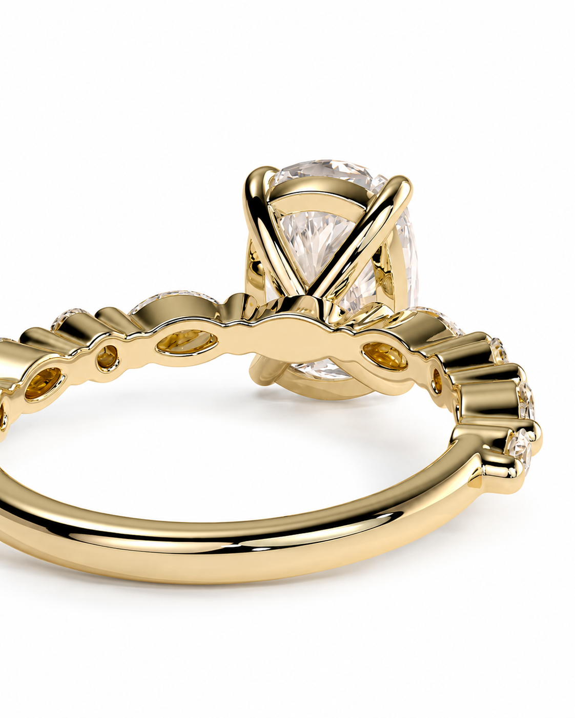 color_10K_YG, color_14K_YG &&A close-up of a yellow gold ring featuring a large oval clear gemstone in a prong setting, with a decorative band accented by small side stones, shown on a white background.