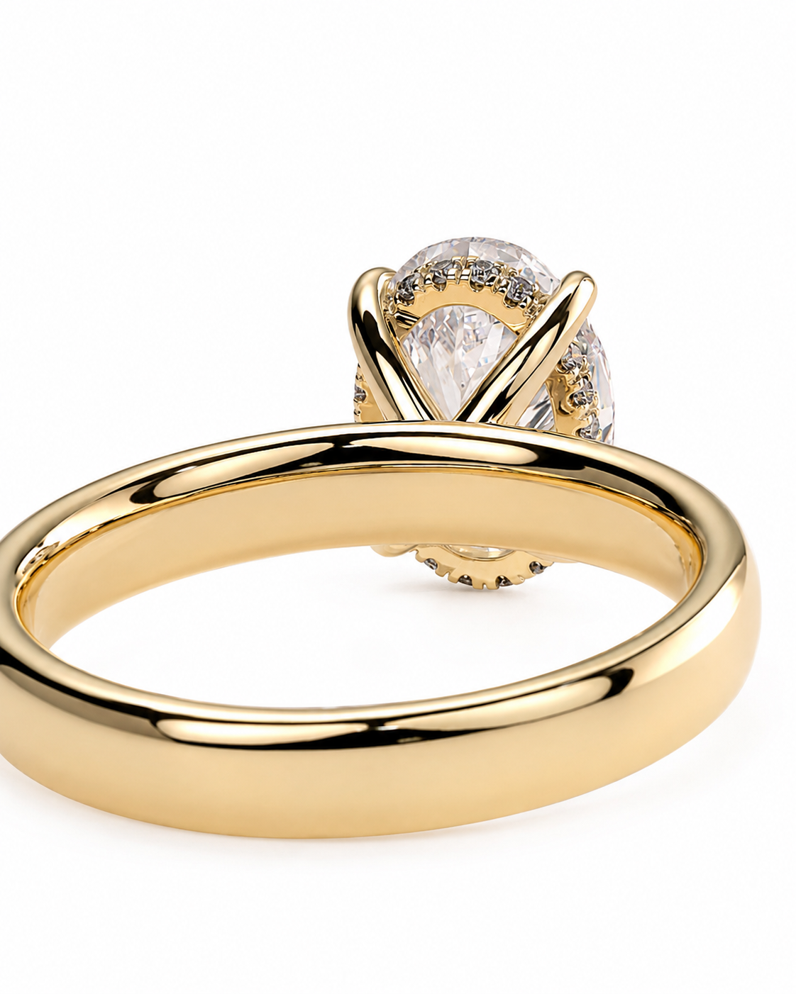 color_10K_YG, color_14K_YG &&A close-up studio shot of a gold ring with a large clear oval center stone and small accent stones, shown on a plain white background.