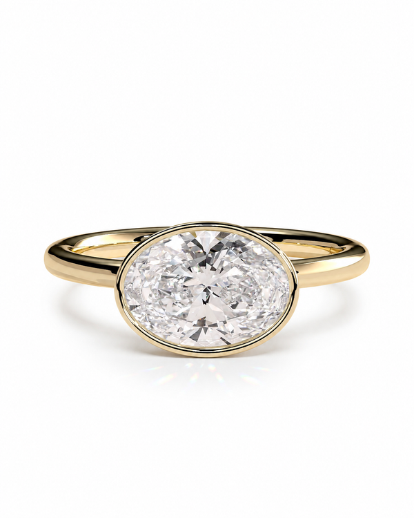 color_10K_YG, color_14K_YG &&An oval diamond engagement ring with a yellow gold band, set against a clean white background.