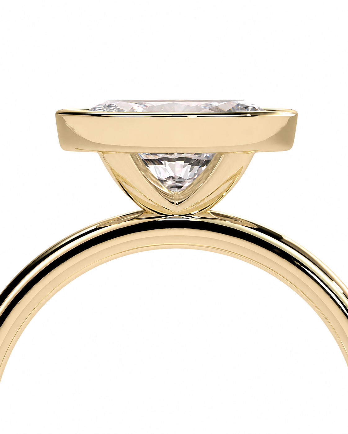 color_10K_YG, color_14K_YG &&A close-up of a yellow gold ring with a triangular bezel setting holding a clear gemstone, shown against a plain white background.