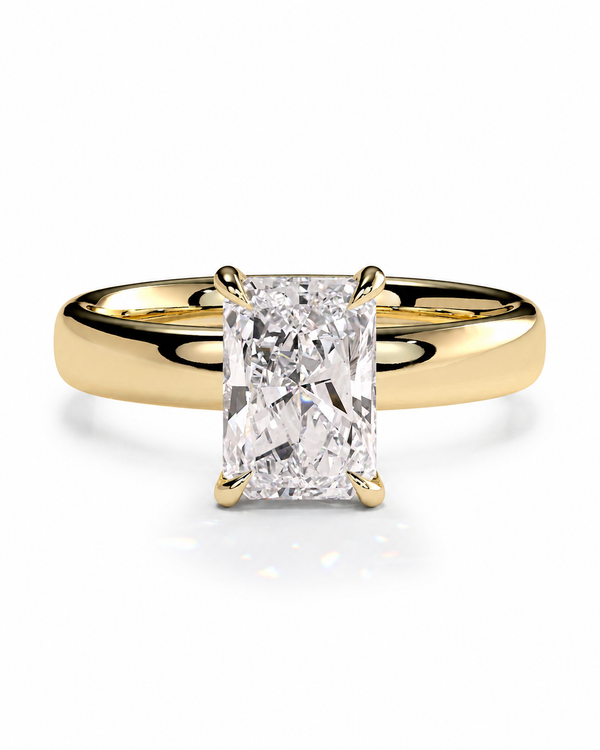 color_10K_YG, color_14K_YG &&A yellow gold solitaire engagement ring featuring a large rectangular radiant-cut diamond center stone in a four-prong setting, shown on a clean white background.