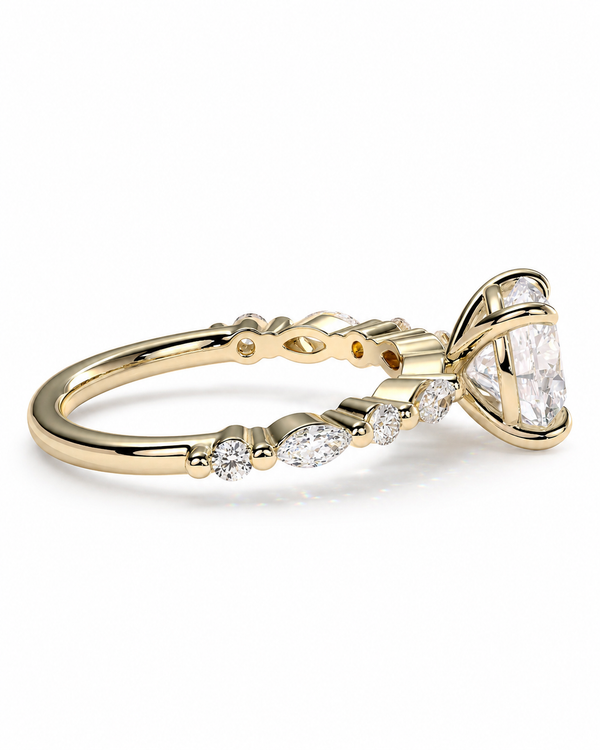 color_10K_YG, color_14K_YG &&A yellow gold diamond ring with a marquise-cut center stone and smaller diamonds along the shank, shown on a clean white background.
