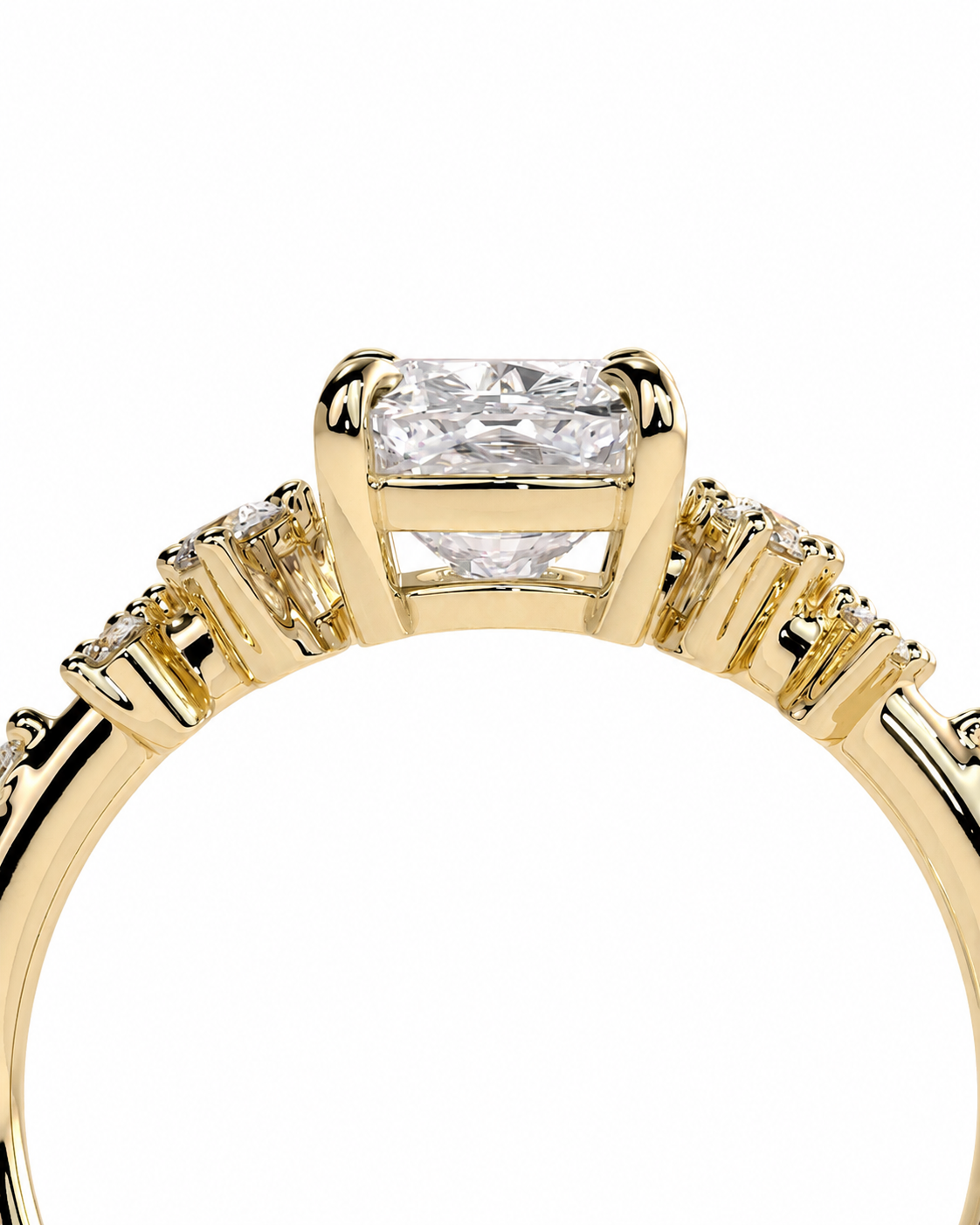 color_10K_YG, color_14K_YG &&A close-up of a yellow gold ring featuring a rectangular clear center stone and smaller side stones on a white background.