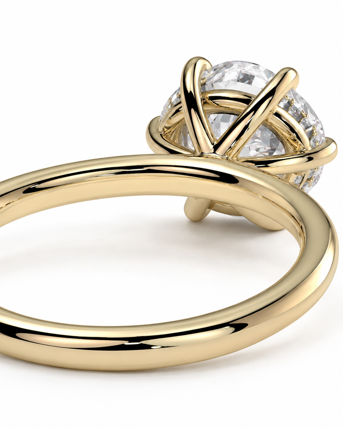 color_10K_YG, color_14K_YG &&
A close-up of a yellow gold ring with a large clear round-cut gemstone in a crisscross prong setting, shown on a clean white background.