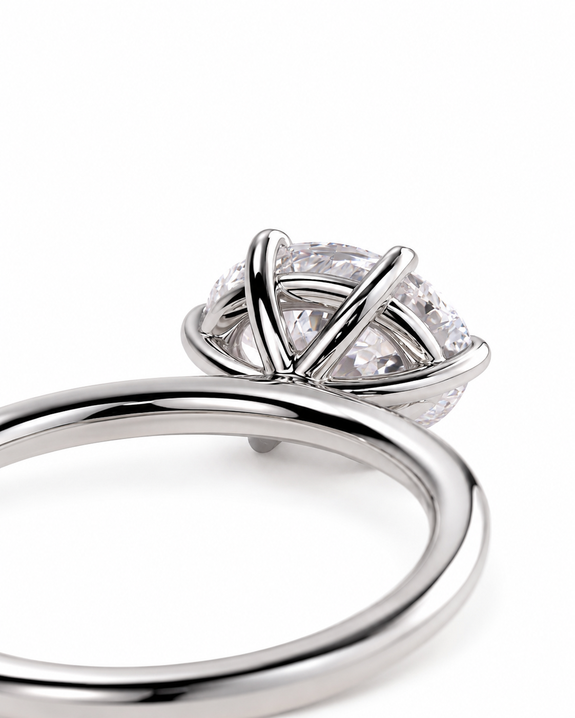 color_925_SIL,color_935_ARG,color_10K_WG, color_14K_WG &&
A close-up shot of a silver-toned ring featuring a unique crisscrossed claw setting for a round clear gemstone, set against a plain white background.