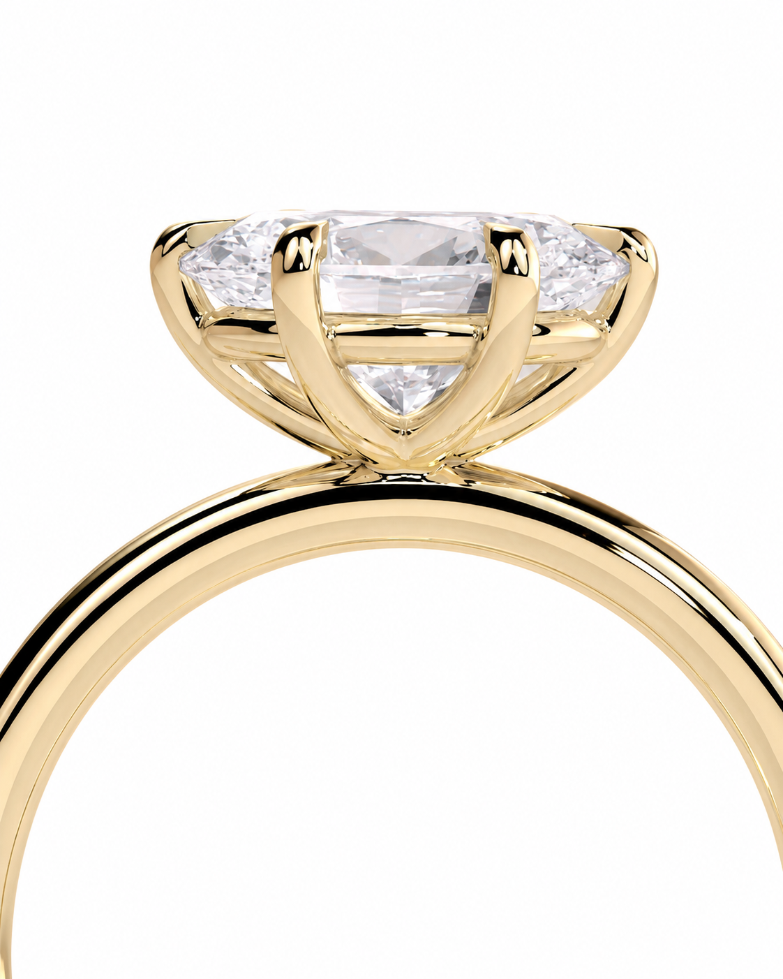 color_10K_YG, color_14K_YG &&
A close-up of a yellow gold solitaire engagement ring featuring a marquise-cut diamond center stone and smaller side diamonds, set against a plain white background.