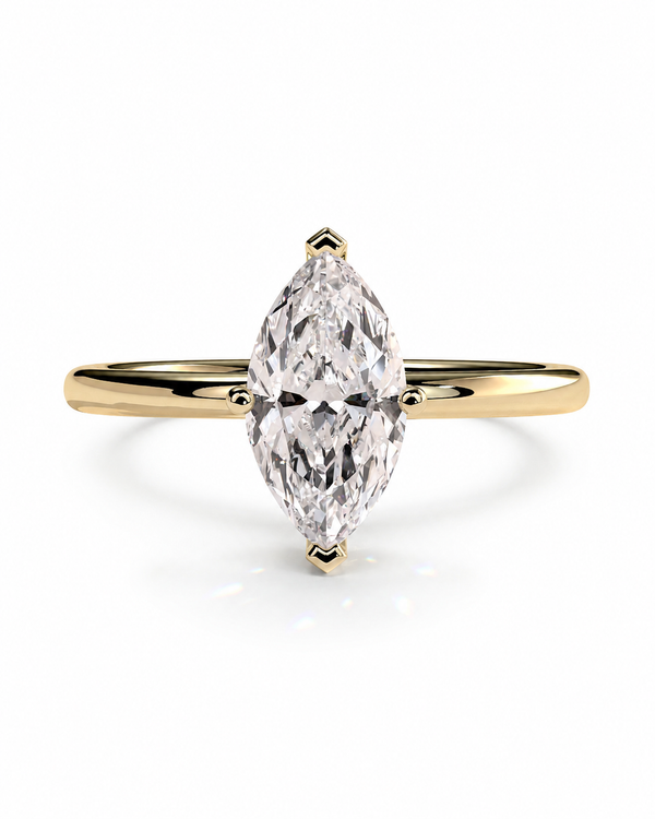 color_10K_YG, color_14K_YG &&A yellow gold ring featuring a marquise-cut clear gemstone in a four-prong setting, shown against a clean white background.