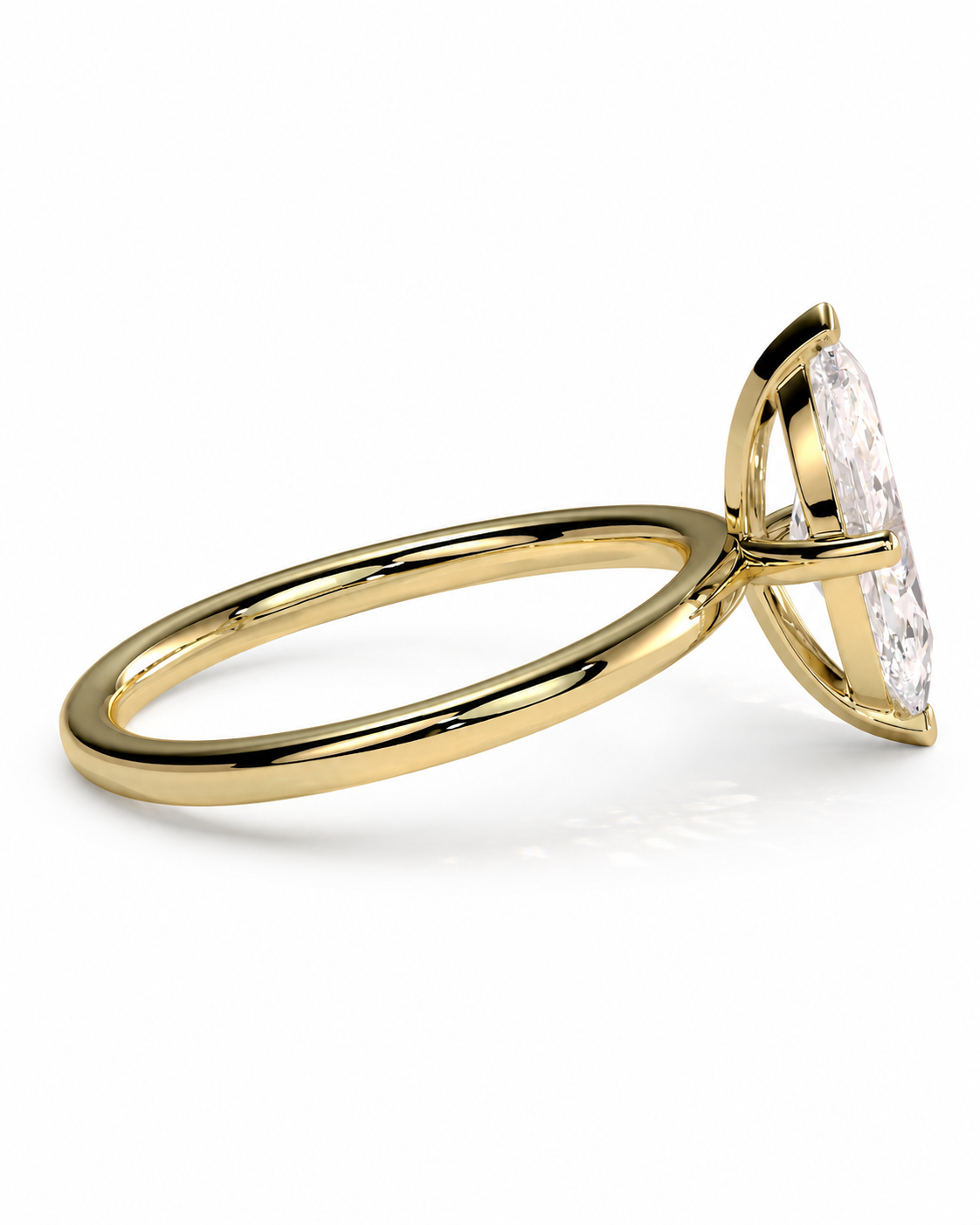 color_10K_YG, color_14K_YG &&A yellow gold ring with a marquise-cut clear gemstone in a prong setting, shown from a side angle on a clean white background.