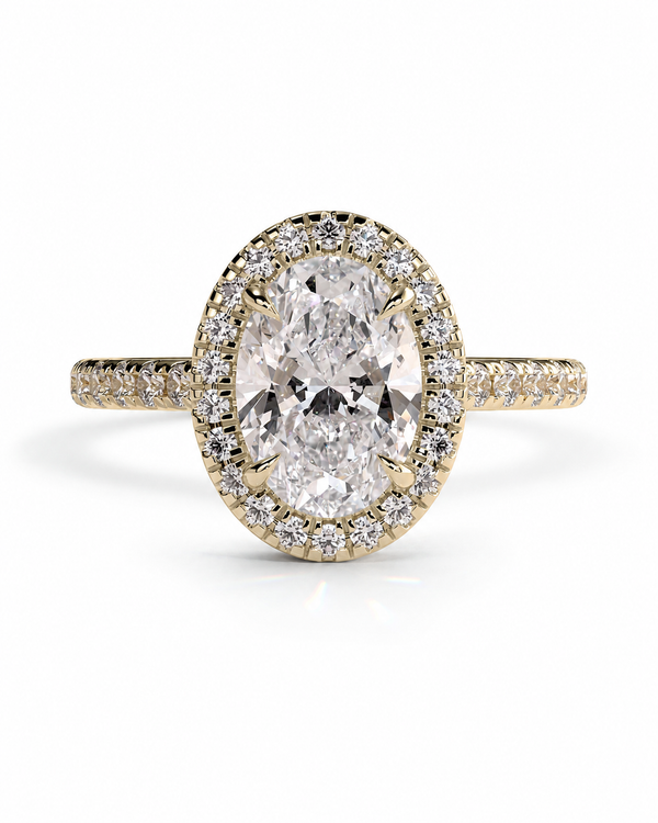 color_10K_YG, color_14K_YG &&An oval halo ring featuring a large oval-cut center stone surrounded by a double halo of small clear stones, set in yellow gold with a pavé band, shown on a white background.