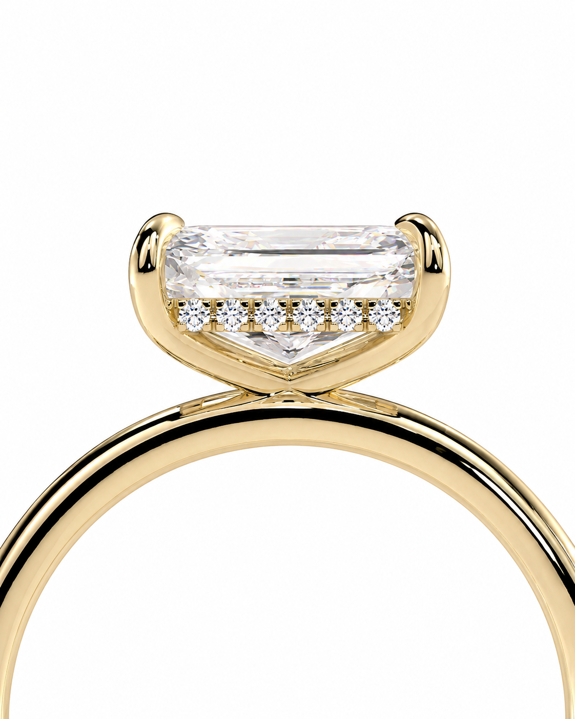 color_10K_YG, color_14K_YG &&A close-up of a yellow gold ring featuring a large rectangular baguette-cut clear center stone with a row of small round stones along the front, set against a plain white background.