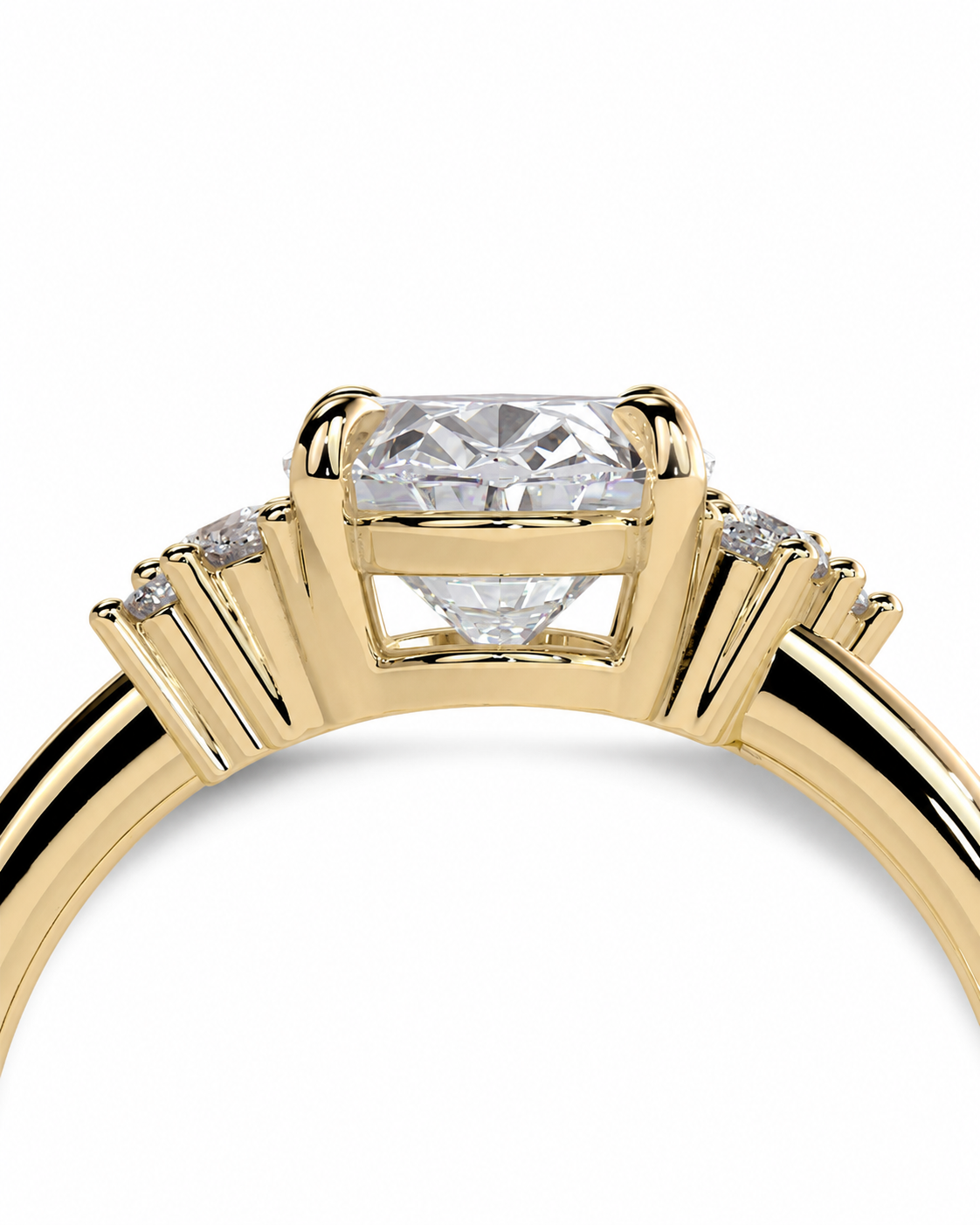 color_10K_YG, color_14K_YG &&A close-up of a yellow gold ring featuring a large round-cut center stone and smaller side stones, shown against a plain white background.
