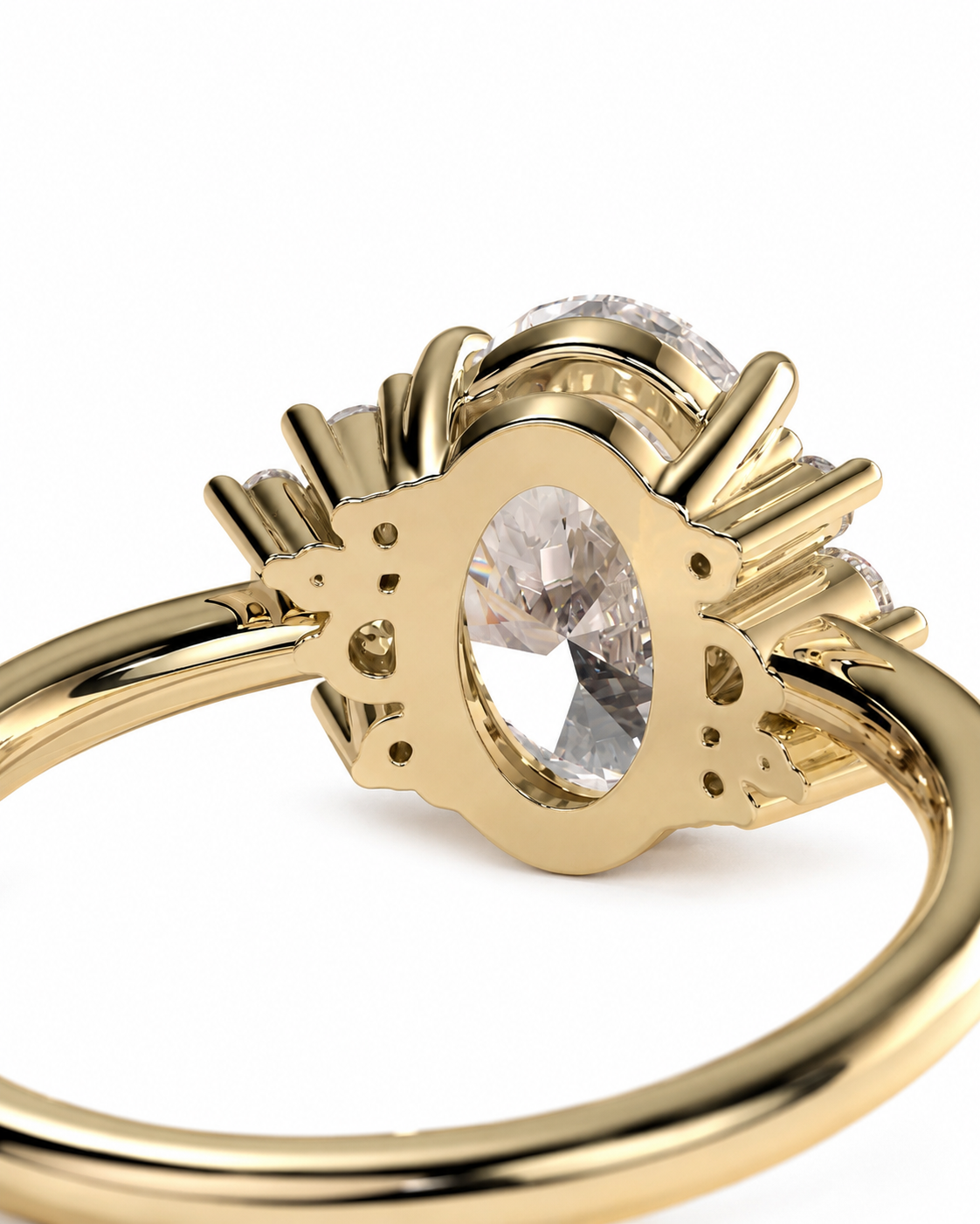 color_10K_YG, color_14K_YG &&A close-up shot of a gold ring featuring an oval clear gemstone in a decorative sunburst setting, on a plain white background.