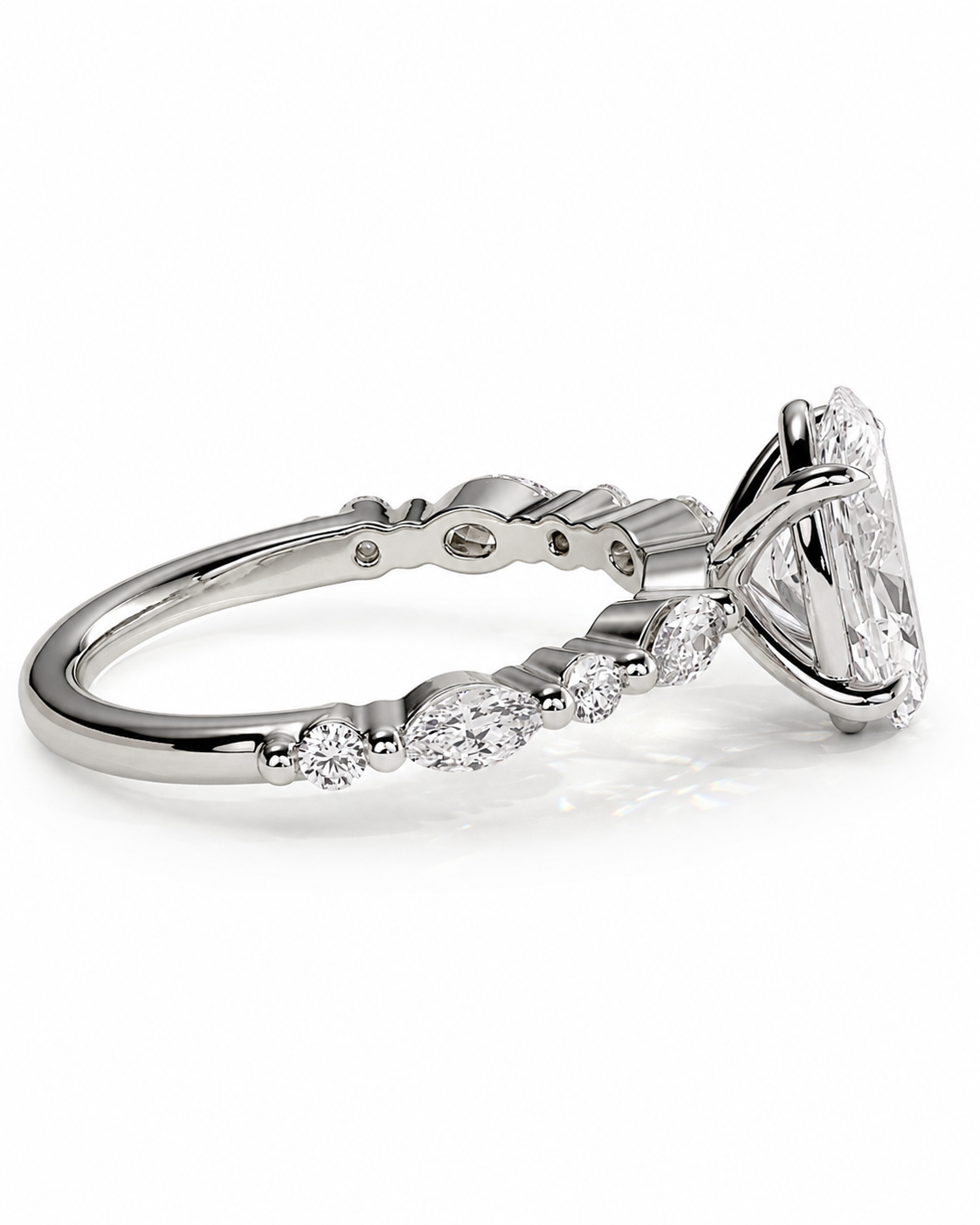 color_925_SIL,color_935_ARG,color_10K_WG, color_14K_WG &&
A silver-toned diamond engagement ring featuring a large round brilliant-cut center stone and a row of smaller round and marquise-cut diamonds along the band, shown on a clean white background.