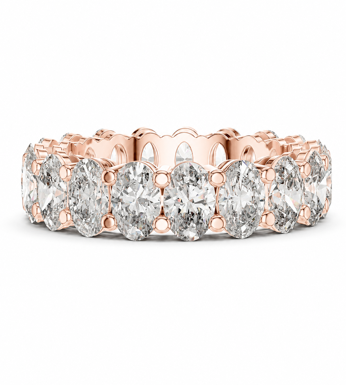 color_10K_RG, color_14K_RG &&	A rose gold eternity ring featuring a continuous row of oval-cut clear diamonds in a prong setting, shown on a clean white background.