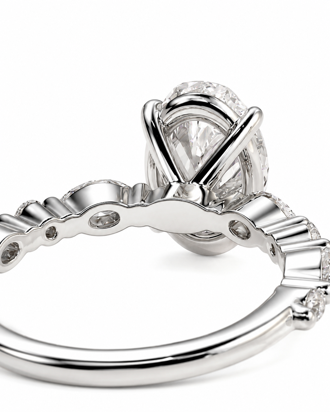 color_925_SIL,color_935_ARG,color_10K_WG, color_14K_WG &&
A close-up studio shot of a silver-toned ring with a large clear oval gemstone in a prong setting, with smaller accent stones along the band, on a white background.