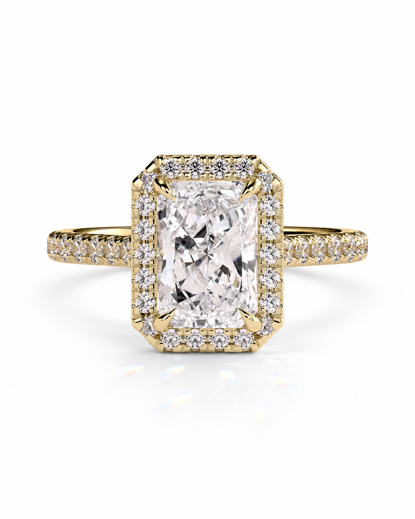 color_10K_YG, color_14K_YG &&A yellow gold ring featuring a large rectangular emerald-cut diamond center stone surrounded by a double halo of small diamonds, with a diamond-encrusted shank, shown on a white background.
