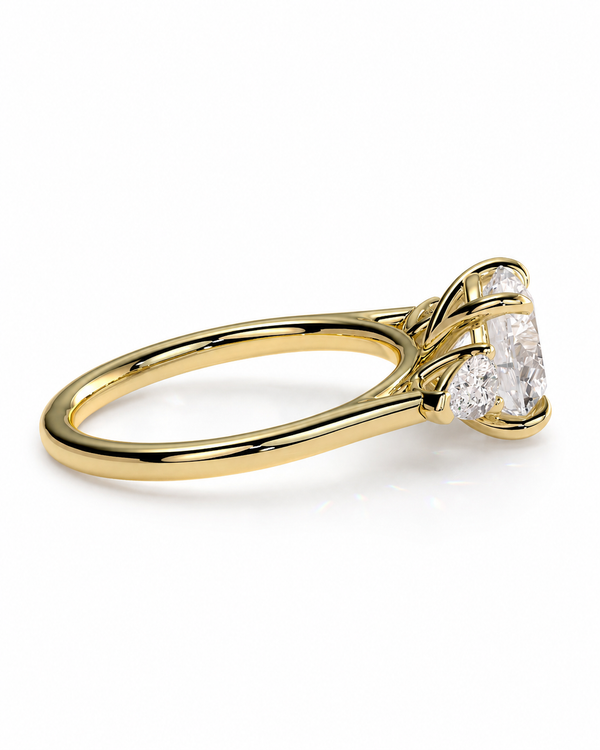 color_10K_YG, color_14K_YG &&A yellow gold ring featuring a large oval-cut clear center stone and smaller side stones in a prong setting, shown on a clean white background.