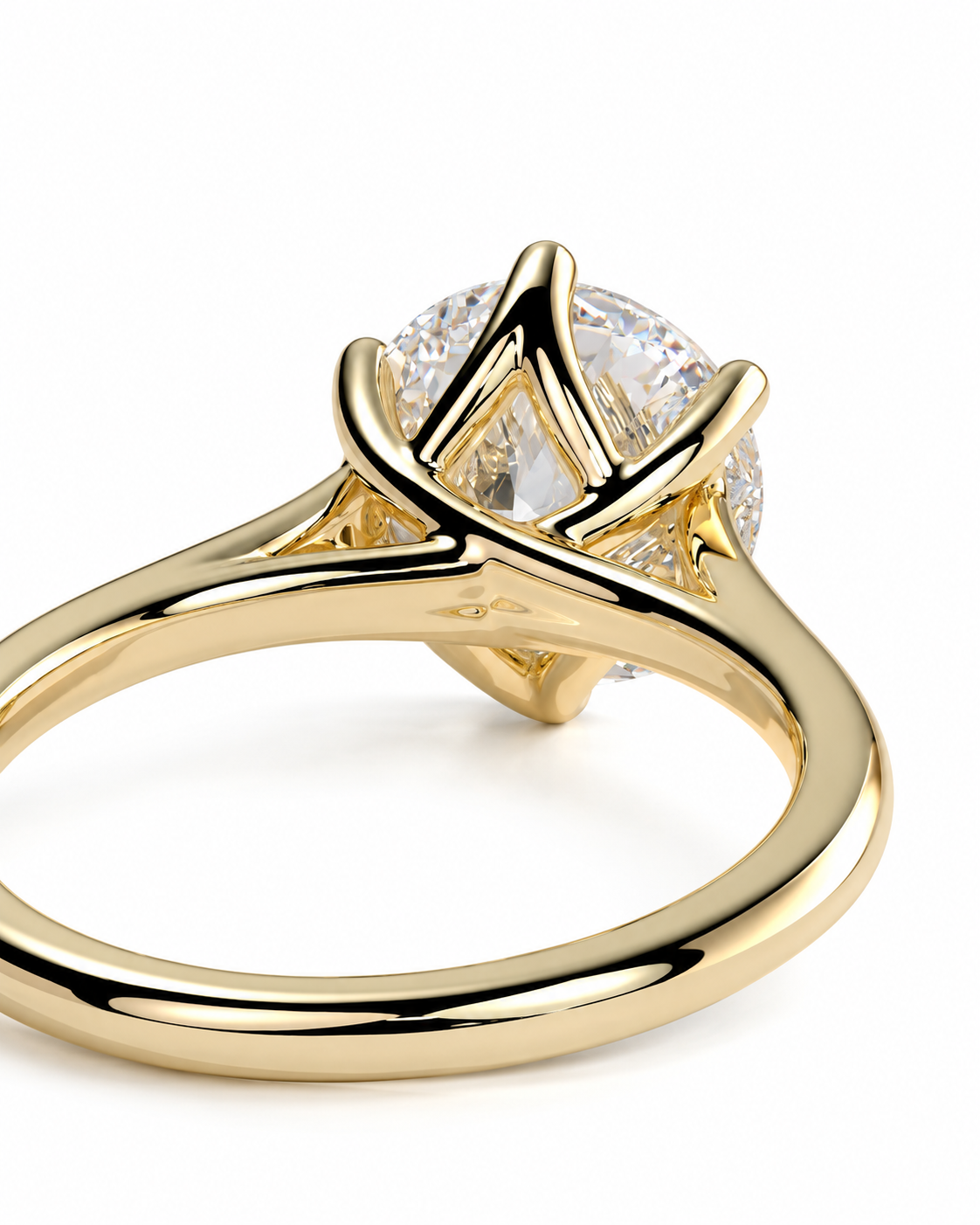 color_10K_YG, color_14K_YG &&A close-up shot of a yellow gold solitaire engagement ring with a round brilliant-cut diamond, set against a clean white background.
