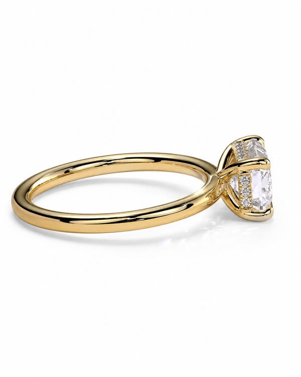 color_10K_YG, color_14K_YG &&A yellow gold solitaire engagement ring with a large cushion-cut clear center stone and small accent stones on the shoulders, shown on a clean white background.
