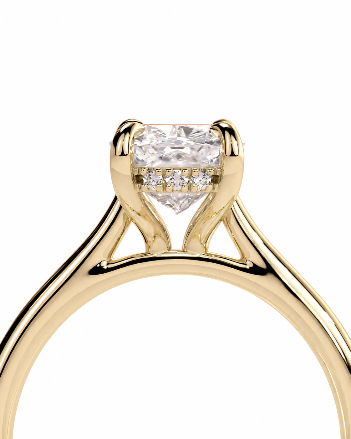 color_10K_YG, color_14K_YG &&A close-up of a yellow gold solitaire engagement ring featuring a rectangular clear center stone and a row of small accent diamonds on the band, set against a plain white background.