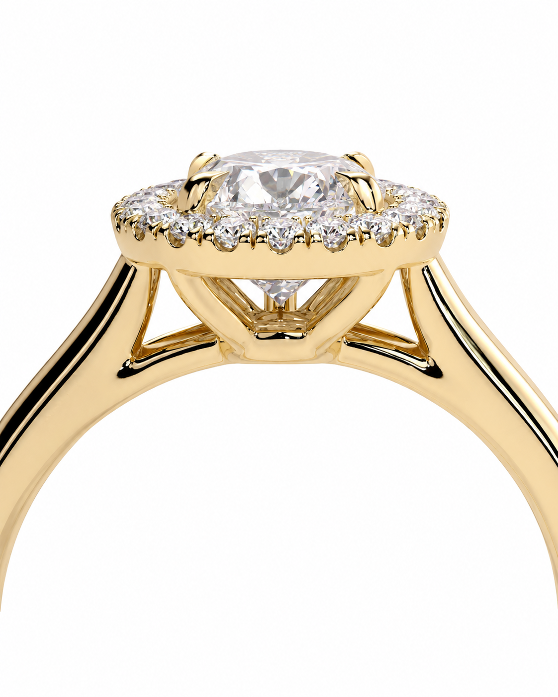 color_10K_YG, color_14K_YG &&A close-up of a yellow gold ring featuring a round-cut center stone surrounded by a halo of small clear stones, set against a plain white background.
