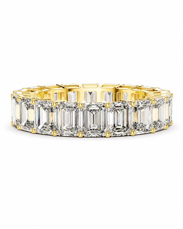 color_10K_YG, color_14K_YG &&	
A gold eternity-style ring band set with clear baguette-cut gemstones, photographed on a clean white background.