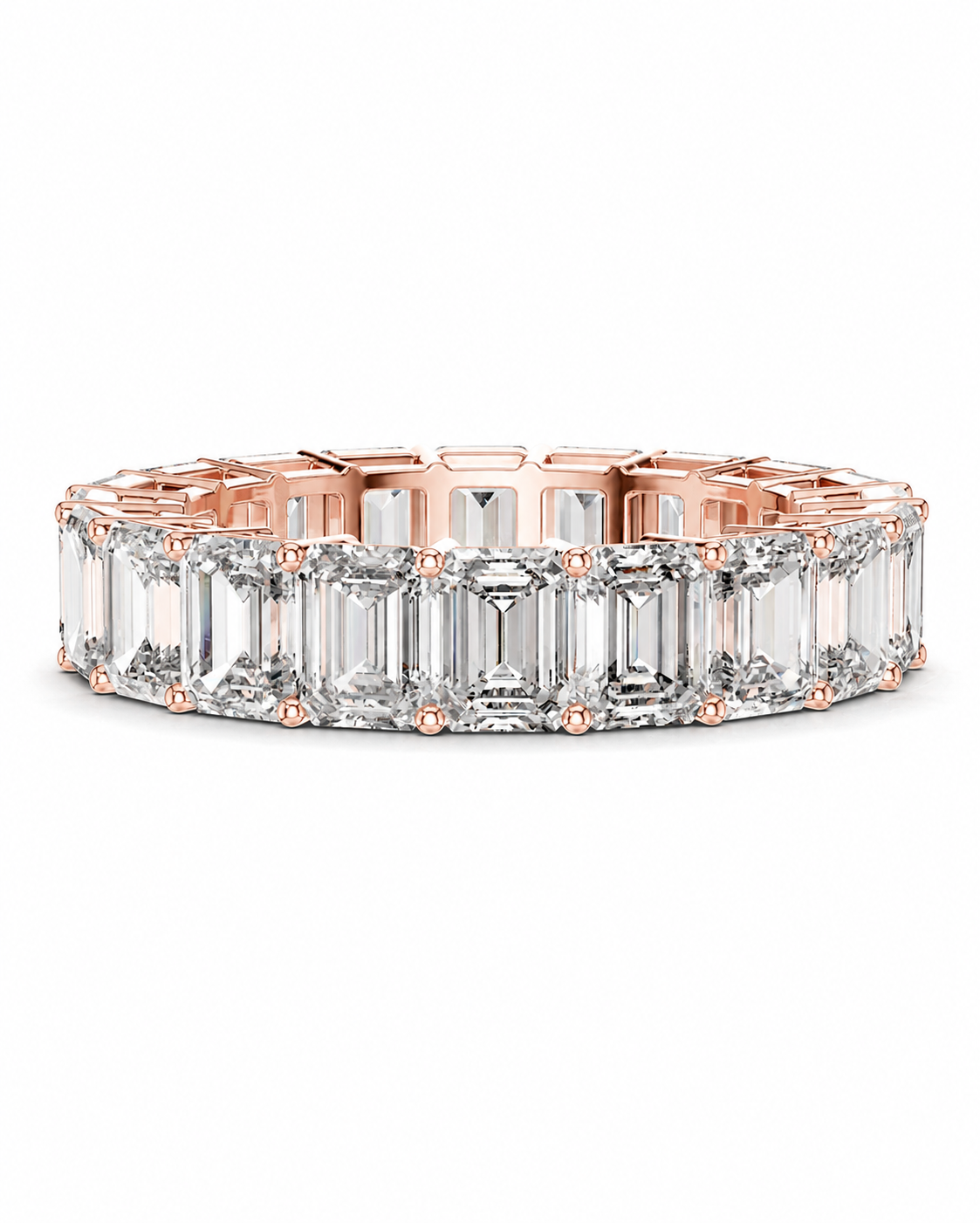 color_10K_RG, color_14K_RG &&	A rose gold eternity band featuring a continuous row of emerald-cut clear gemstones in a prong setting, shown against a plain white background.